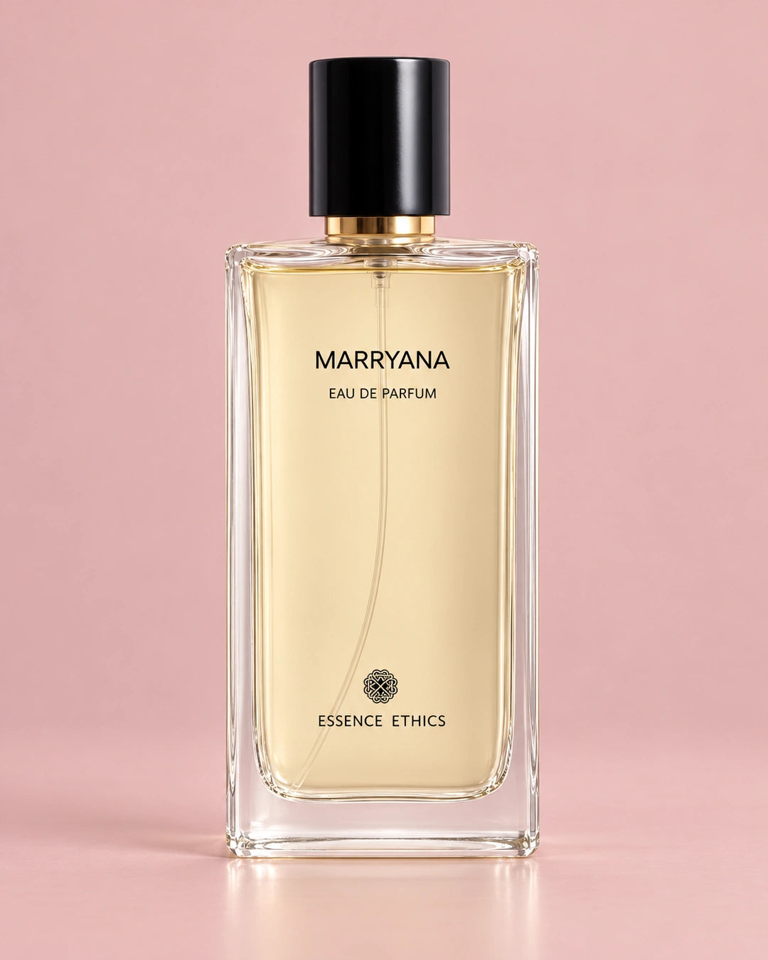 Marryana perfume by ESSENCE ETHICS in a clear glass bottle with a black cap against a soft blush pink background.