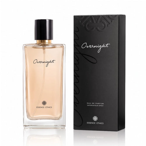 Overnight Eau de Parfum by ESSENCE ETHICS in a clear glass bottle beside its black presentation box on a white background.
