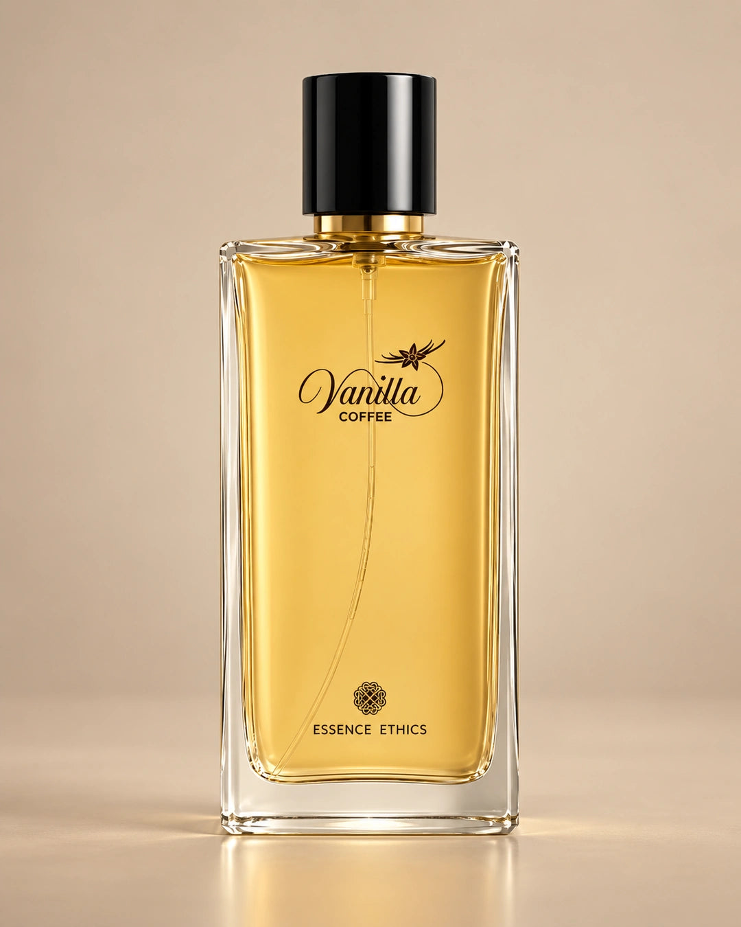 Vanilla Coffee perfume by ESSENCE ETHICS in a clear glass bottle with golden liquid against a warm beige background.